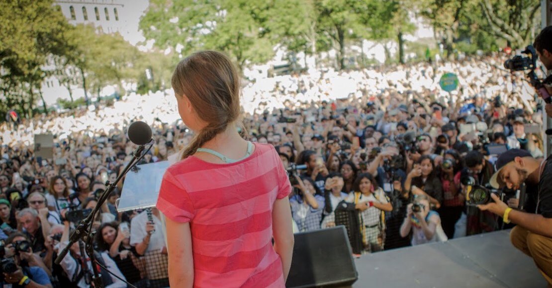 Greta Thunberg speaks before a crowd