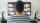 The back of a man watching TV