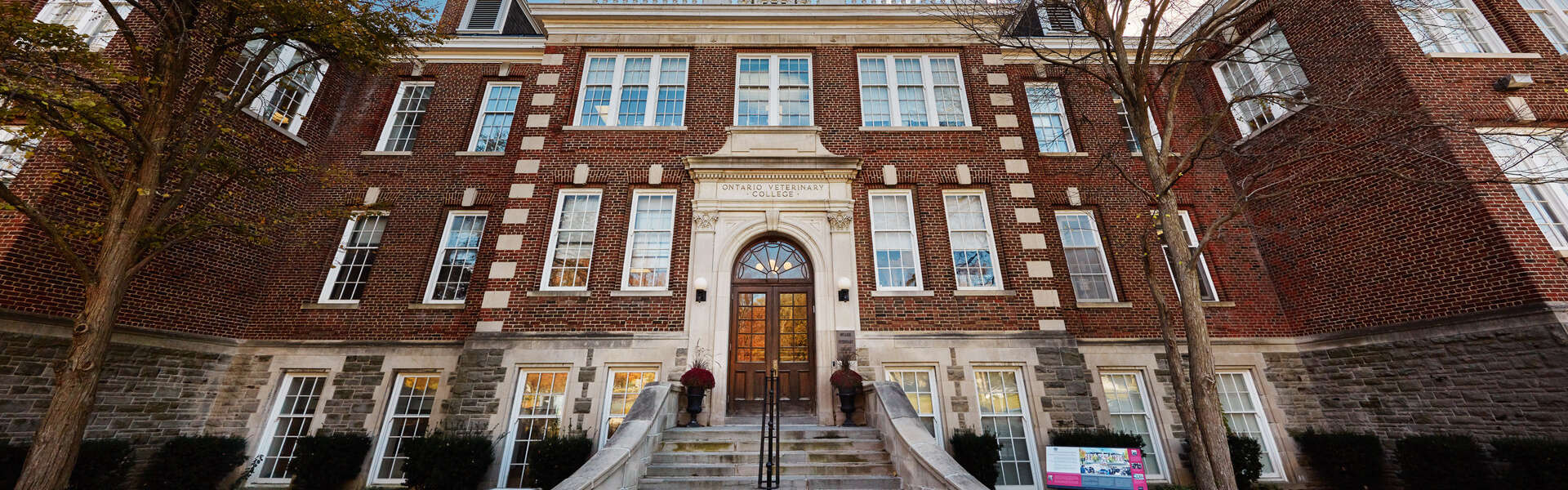 A wide-angle view of the frong entrance of the Ontario Veterinary College main building