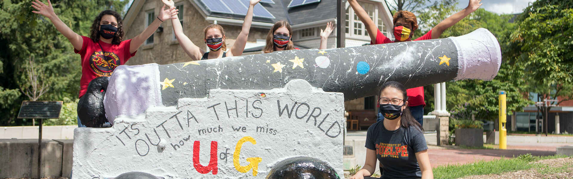 Five students wearing masks gather at the Cannon on the U of G campus