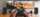 hands hold a gaming console in front of a TV