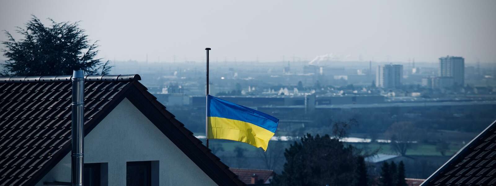 The Ukrainian flag (top half blue, bottom half yellow) flies at half mast in Germany.