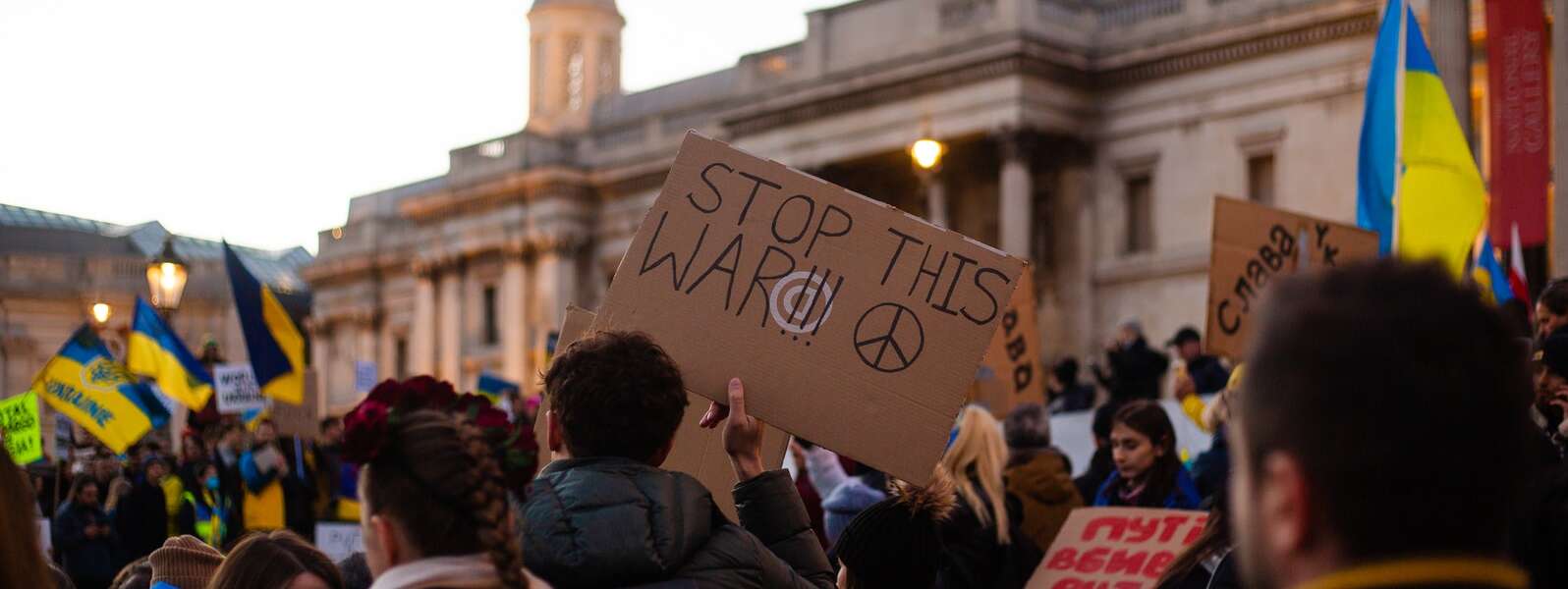 Protesters in London carry signs in support of Ukraine