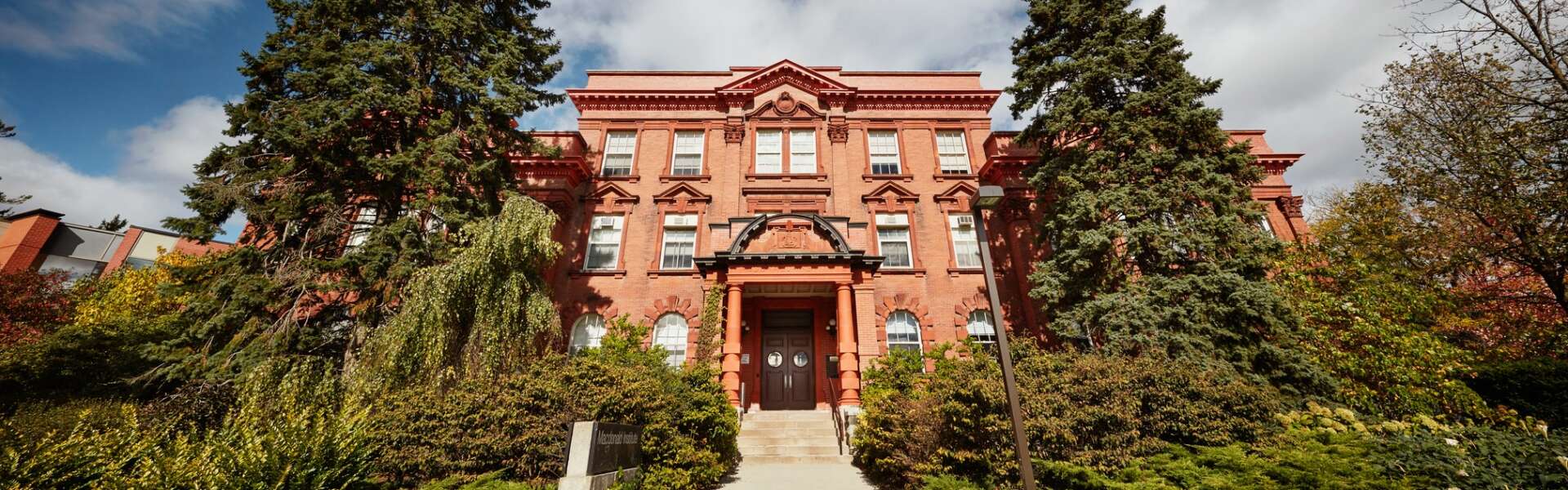 a wide view of the sandstone building of Macdonald Hall