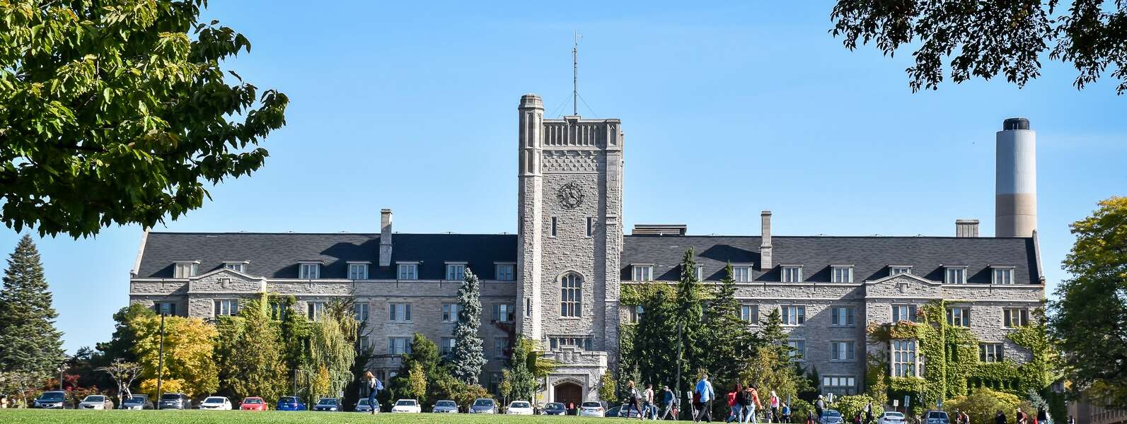 A wide view of Johnston Hall and the green field before it