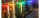 large stainless steel vats each let a different colour of the rainbow