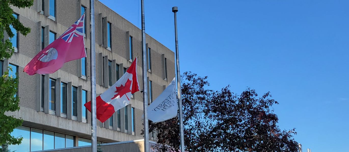 University Centre flags at half mast in summer
