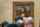 The backs of heads in front of Da Vinci's "Mona Lisa"