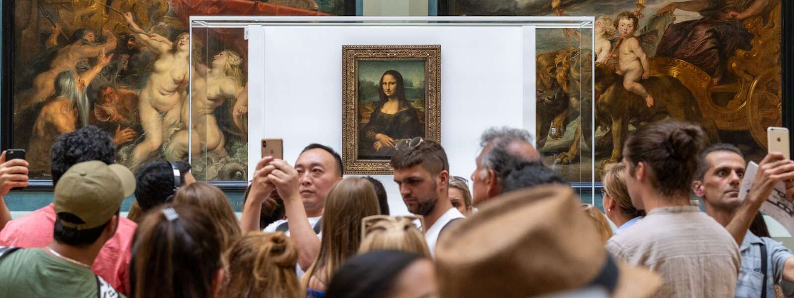 people gathering near Monalisa painting