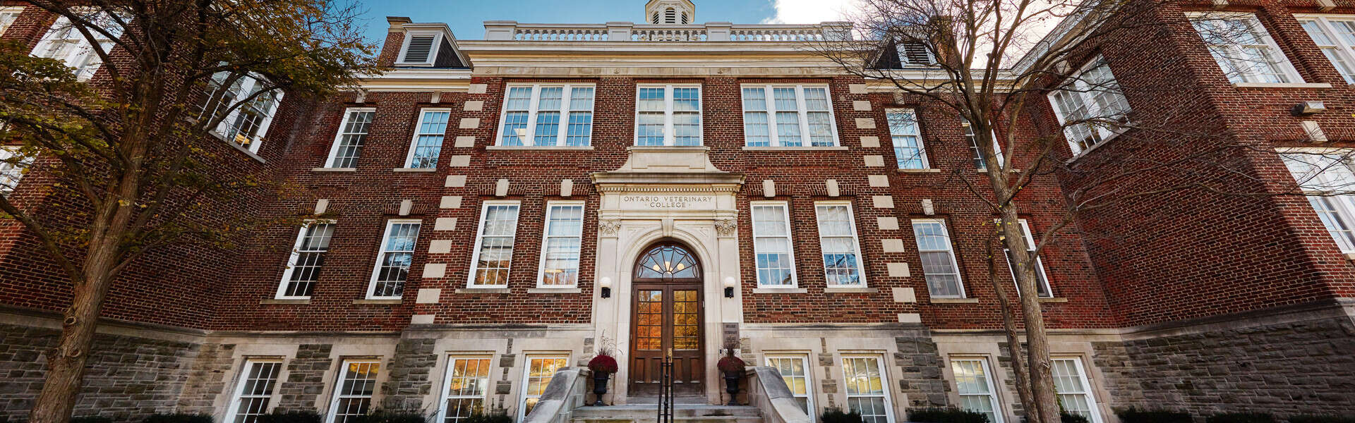 A wide-angle view of the frong entrance of the Ontario Veterinary College main building