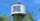 a water tower with the words oneida nation sits above a stand of trees