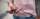 A closeup of a hand holding a cellphone
