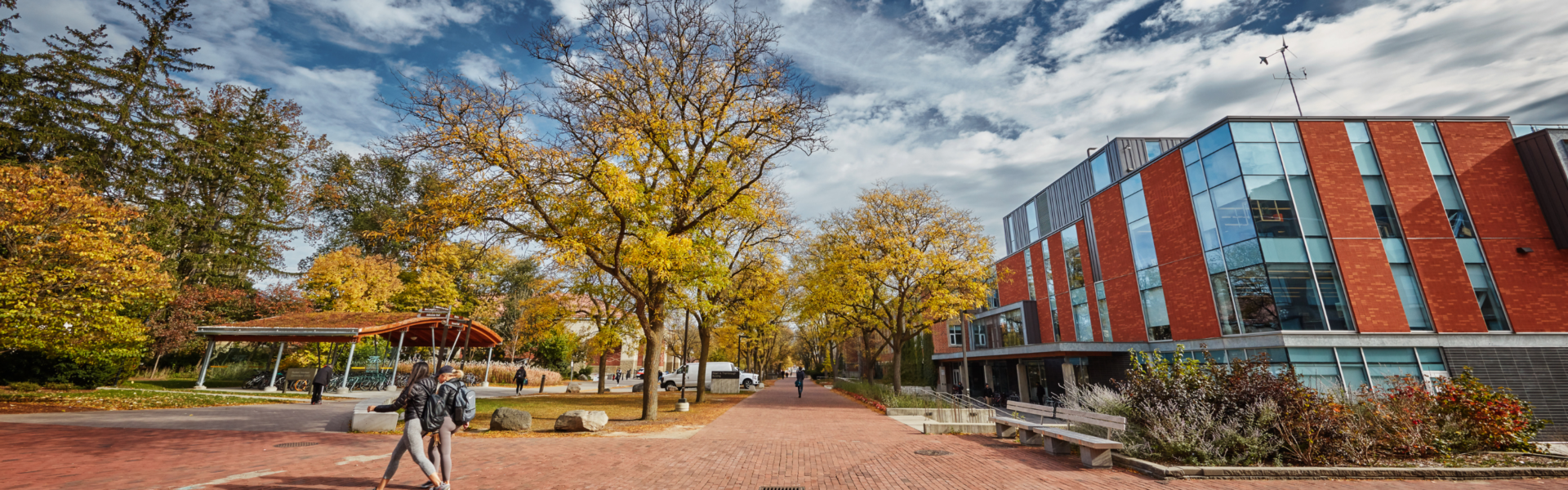 Students walk down the path near the Albert. A. Thornbrough building.