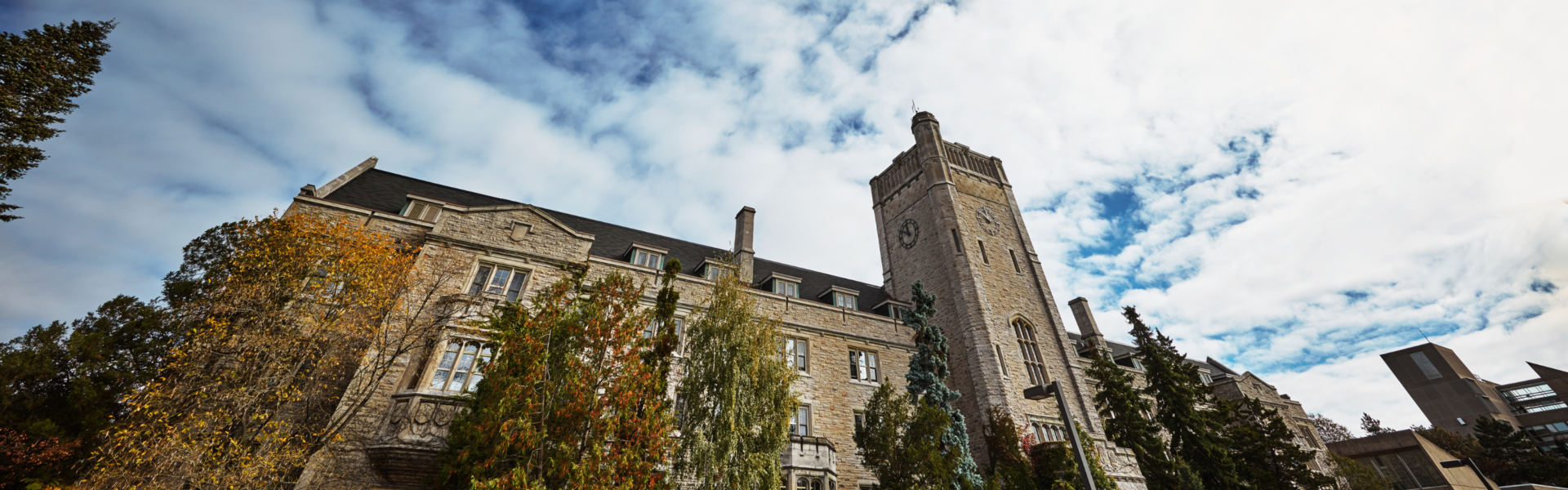 Johnston Hall against a partly-cloudy sky.