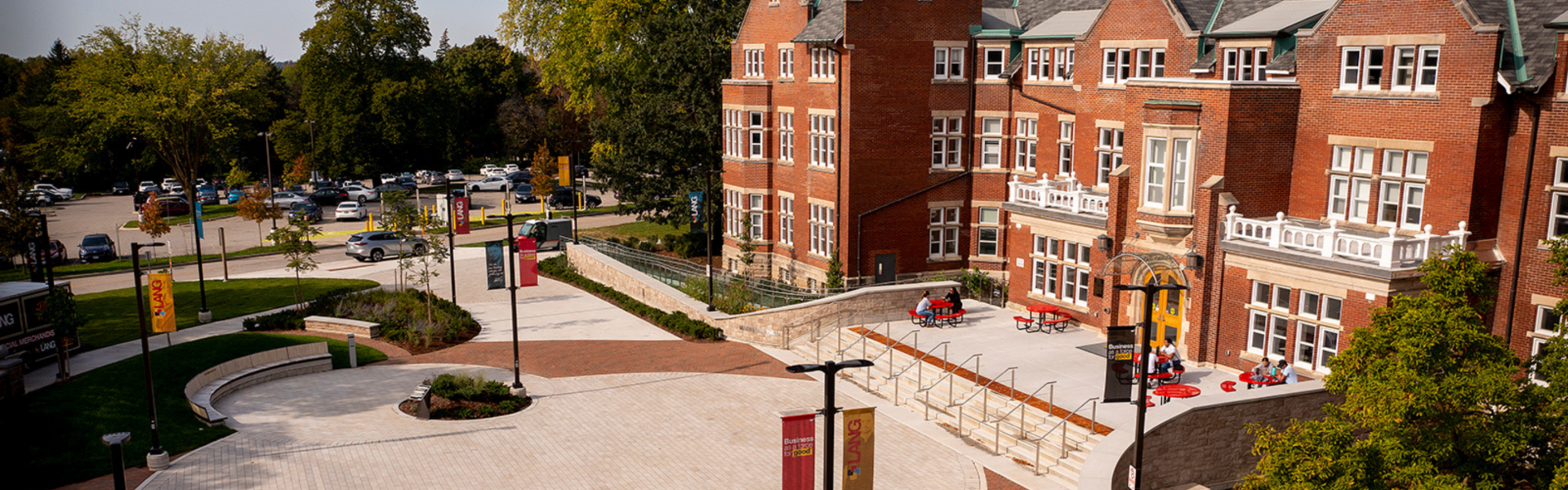 Aerial shot of Macdonald Hall, a red brick building.