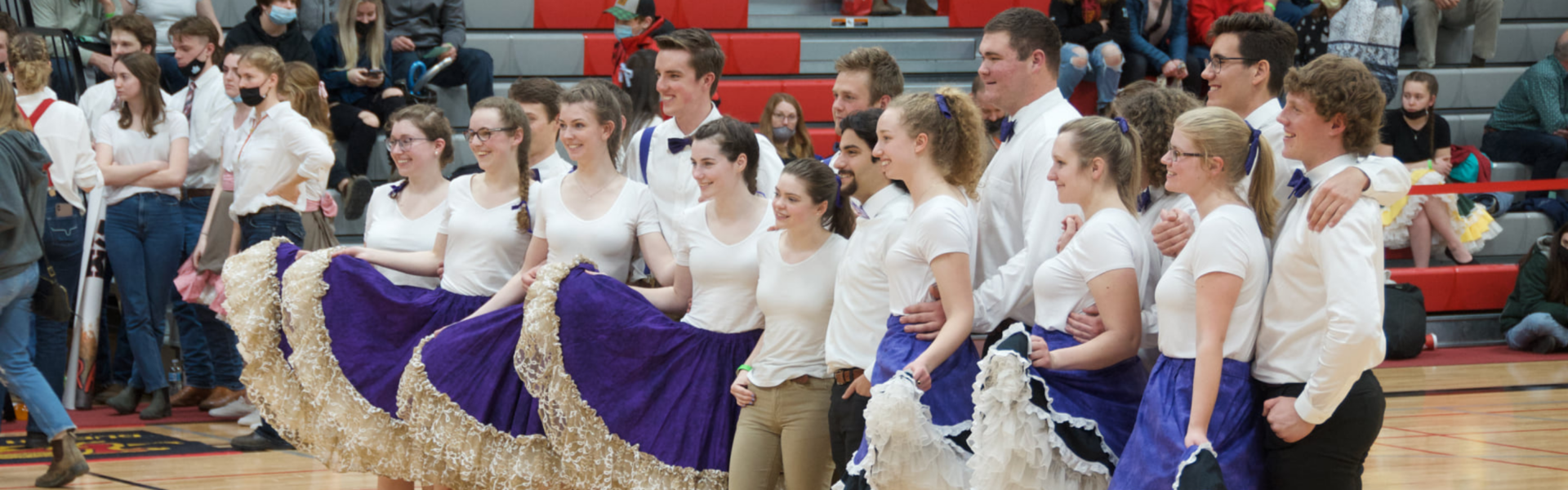 A group of contestants in the College Royal Square Dance competition pose for a group photo.