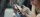 Hands holding smart phone during a commute