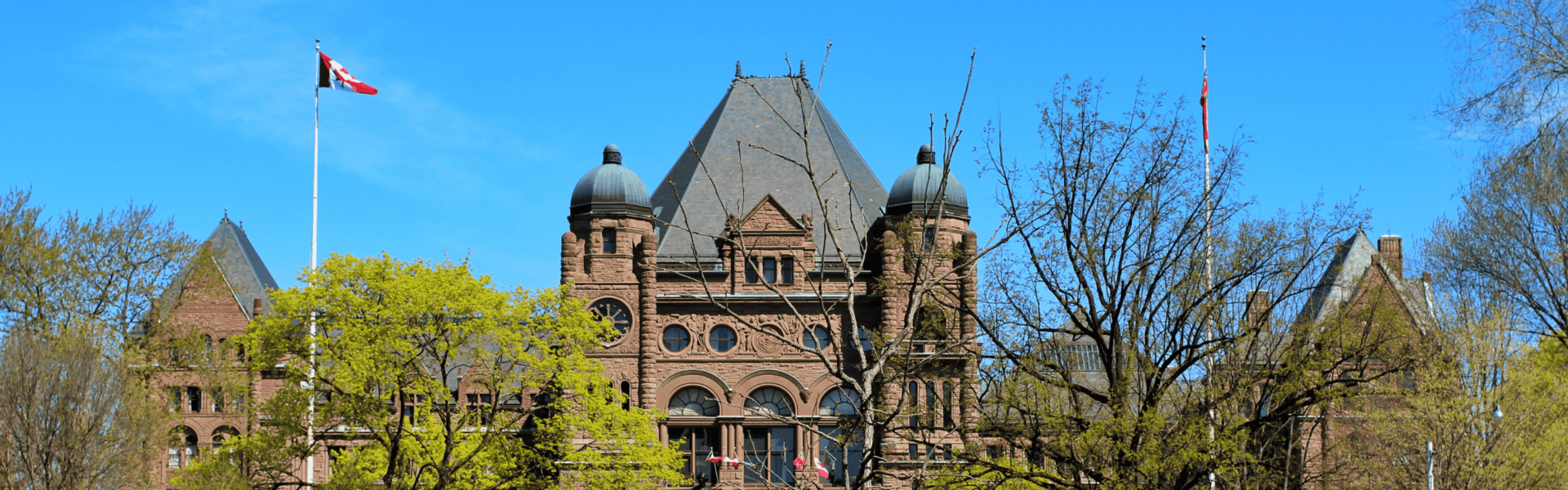 Queen's Park, the site of the Ontario Legislative Building, shot on a clear sunny day