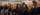 a group of students in black grad gowns wait for a convocation ceremony