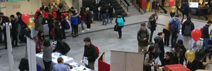Students exploring booths at the University Centre.